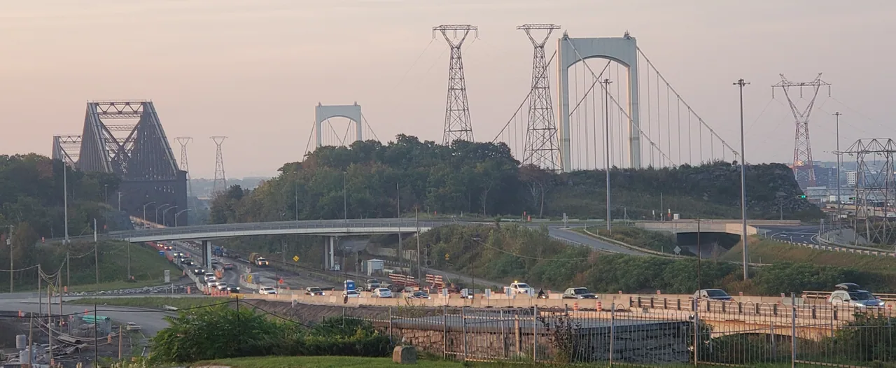 Québec Bridge and Pierre-Laporte Bridge beyond roadworks and power lines.