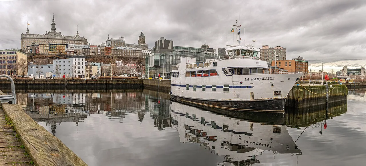 A passenger boat and waterfront buildings at Bassin Louise in Québec City.